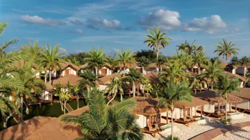 Bangalôs do resort cercados por vegetação tropical