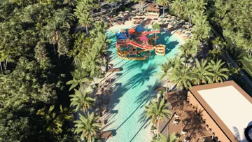 Vista aérea das piscinas e toboáguas em meio à vegetação